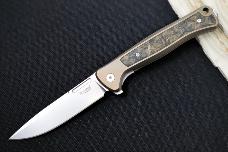 Lionsteel Skinny Integral Flipper - Drop Point Blade / CPM-Magnacut Steel / Bronzed Anodized Titanium Handles with Gold Dark Matter Carbon Fiber Inlay SK01BR