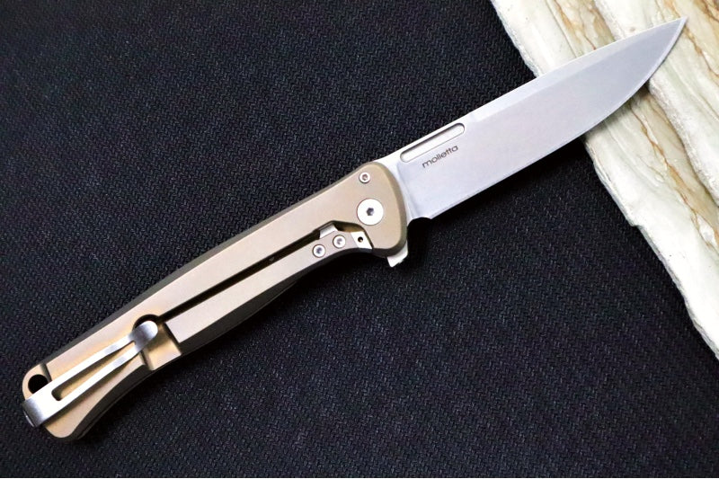 Lionsteel Skinny Integral Flipper - Drop Point Blade / CPM-Magnacut Steel / Bronzed Anodized Titanium Handles with Gold Dark Matter Carbon Fiber Inlay SK01BR