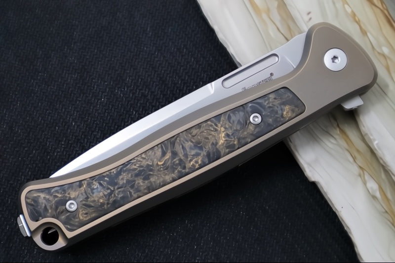 Lionsteel Skinny Integral Flipper - Drop Point Blade / CPM-Magnacut Steel / Bronzed Anodized Titanium Handles with Gold Dark Matter Carbon Fiber Inlay SK01BR