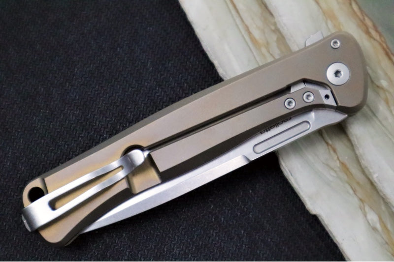 Lionsteel Skinny Integral Flipper - Drop Point Blade / CPM-Magnacut Steel / Bronzed Anodized Titanium Handles with Gold Dark Matter Carbon Fiber Inlay SK01BR