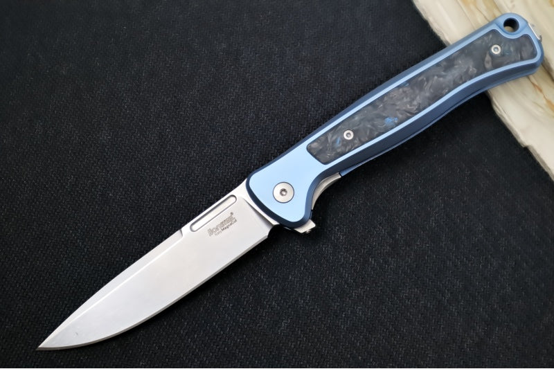 Lionsteel Skinny Integral Flipper - Drop Point Blade / CPM-Magnacut Steel / Blue Anodized Titanium Handles with Blue Dark Matter Carbon Fiber Inlay SK01BL