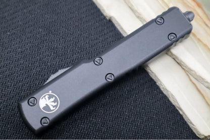 Microtech UTX-70 Tactical OTF - Black Anodized Aluminum Handle / Dagger with Full Serrations / Black Finish 147-3T