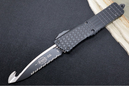 Microtech Combat Troodon Signature Series OTF Frag HS Rescue - Black Finish / Drop Point Blade with Rescue Hook / Black Anodized Aluminum Handle in a Frag Pattern 601-3THS