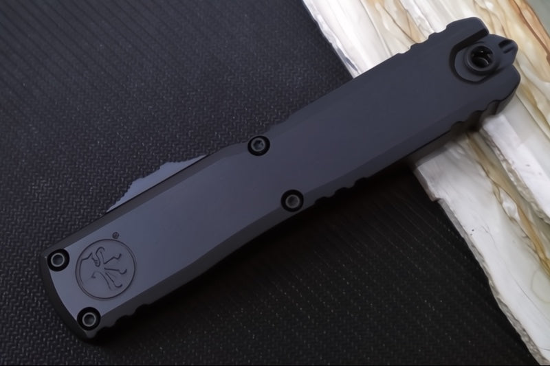 Microtech Ultratech ZBP (Zero Blade Play) OTF Tactical - Black Finish / Single Edge with Partial Serrate / Black Anodized Aluminum Handle 1121-2T