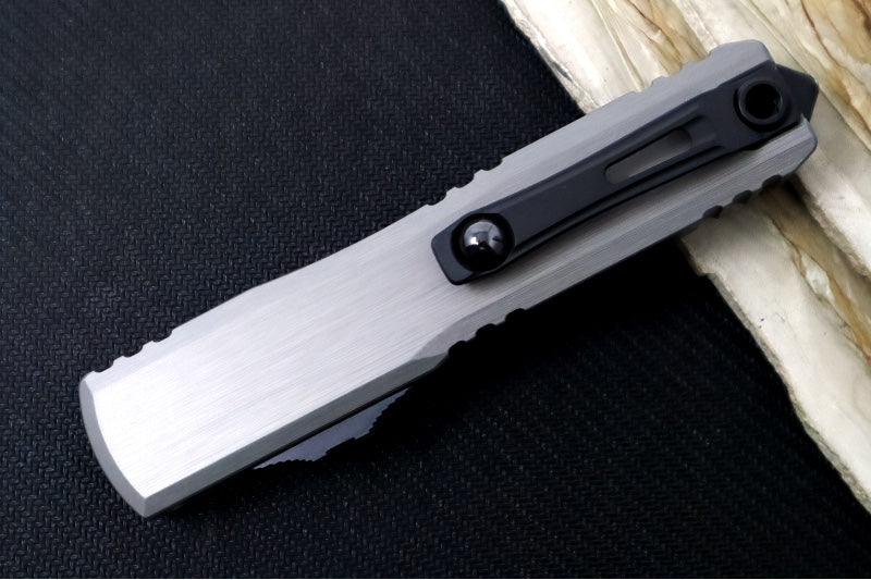 Microtech Ultratech ZBP (Zero Blade Play) OTF - Black Finish / Single Edge with Partial Serrate / Natural Clear Anodized Aluminum Handle 1121-2NC