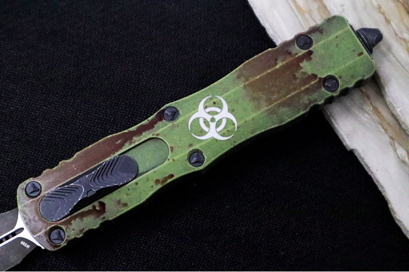 Microtech Dirac Delta OTF Outbreak - Double Edge / Dirty Apocalyptic Finish / Green Anodized Aluminum Handle with Blood Splatter 227-1OBDS - Northwest Knives