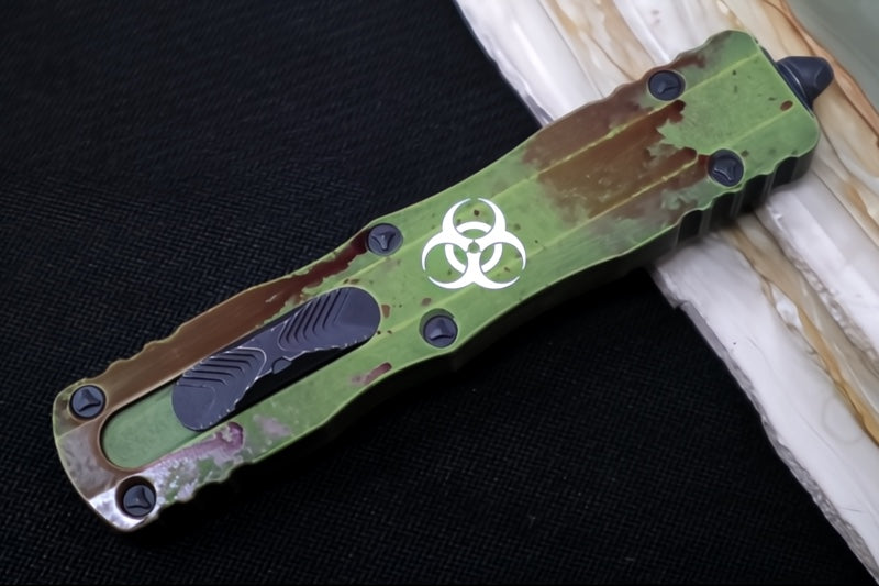 Microtech Dirac Delta OTF Outbreak - Double Edge / Dirty Apocalyptic Finish / Green Anodized Aluminum Handle with Blood Splatter 227-1OBDS - Northwest Knives