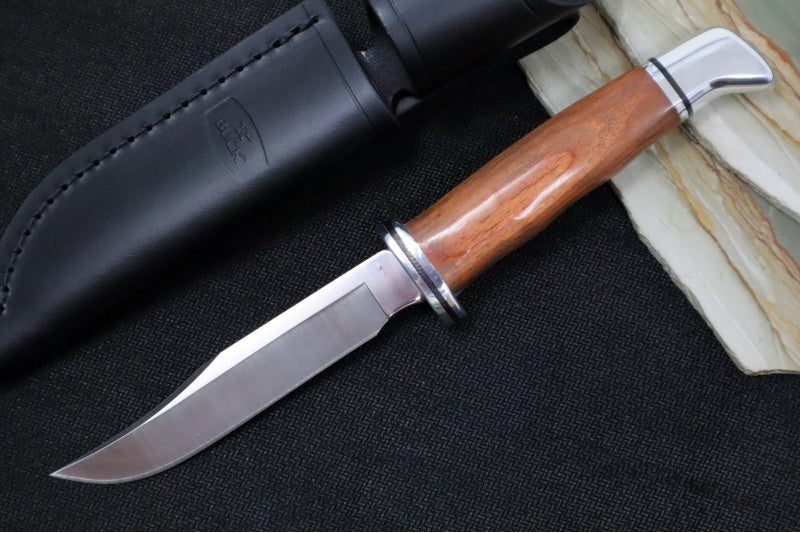 Buck 102 Woodsman Knife - 420HC Steel / DymaLux Cocobolo Heritage Handle / Black Leather Sheath 0102CCS1