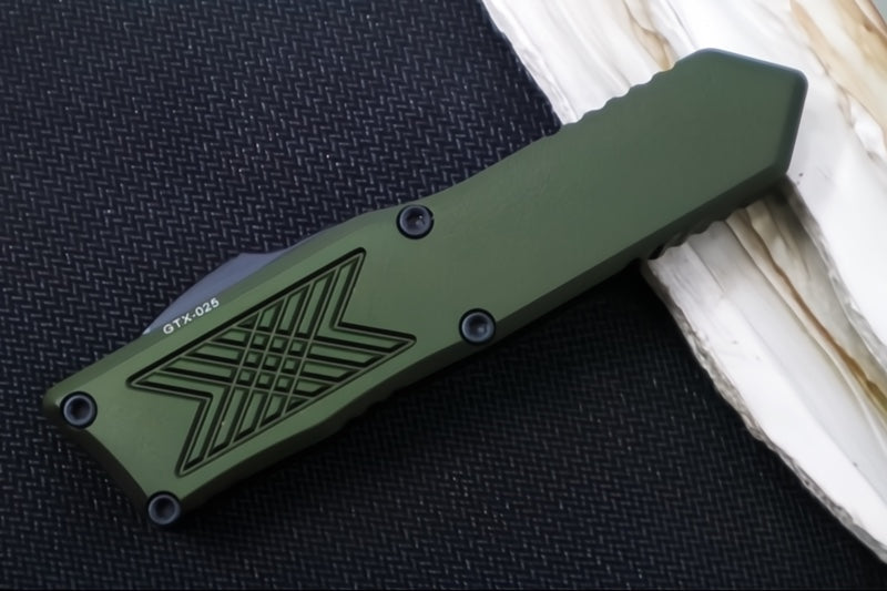 Guardian Tactical GTX-025 OTF - 2-Toned Black Finish / Elmax Steel / Drop Point Blade / OD Green Anodized Aluminum Handle 12-8211