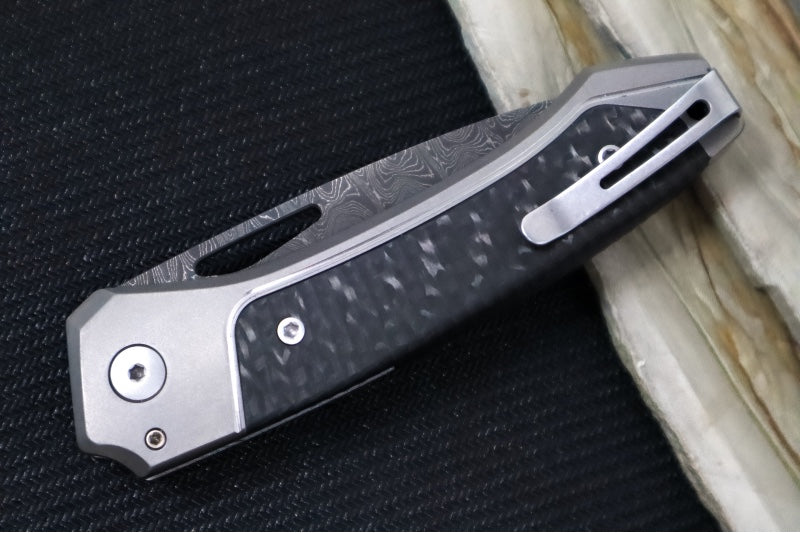 Lionsteel Twain Solid Button Lock Folder - Drop Point Blade / Scrambled Chad Nichols Damascus Steel / Gray Titanium Handles with Integral Carbon Fiber Inlay TW-D-GY
