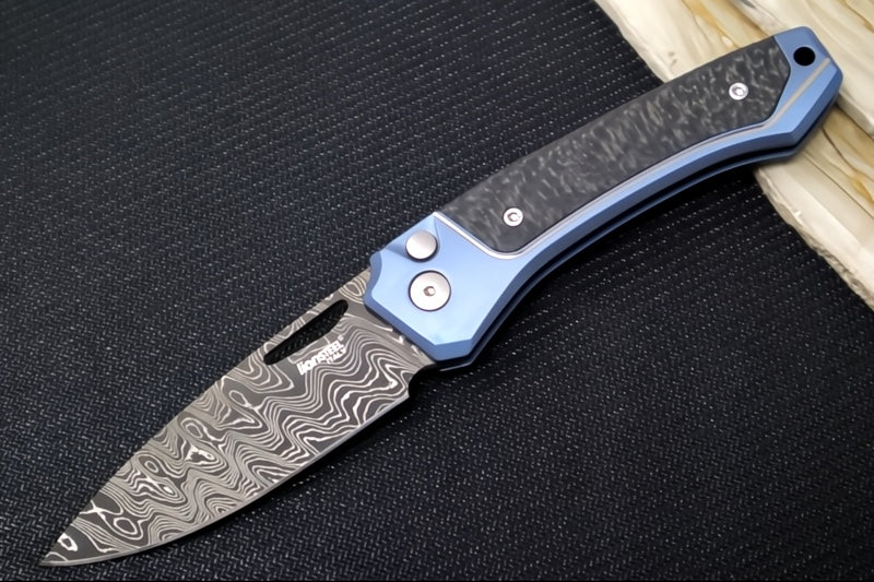 Lionsteel Twain Solid Button Lock Folder - Drop Point Blade / Scrambled Chad Nichols Damascus Steel / Blue Titanium Handles with Integral Carbon Fiber Inlay TW-D-BL