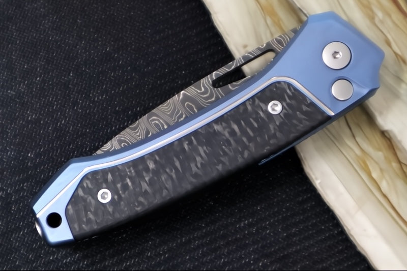 Lionsteel Twain Solid Button Lock Folder - Drop Point Blade / Scrambled Chad Nichols Damascus Steel / Blue Titanium Handles with Integral Carbon Fiber Inlay TW-D-BL