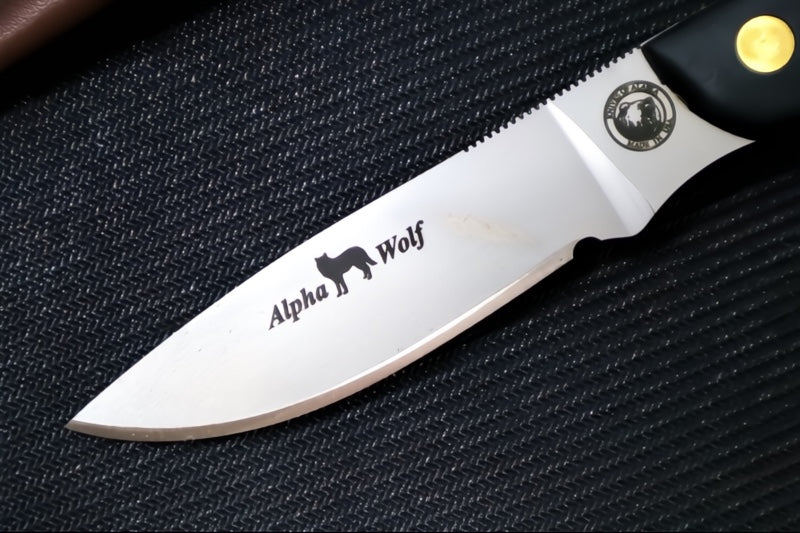 Knives of Alaska Alpha Wolf Fixed Blade - Black Surgrip Handle / D2 Tool Steel / Drop Point Blade / Brown Leather Sheath 00326FG