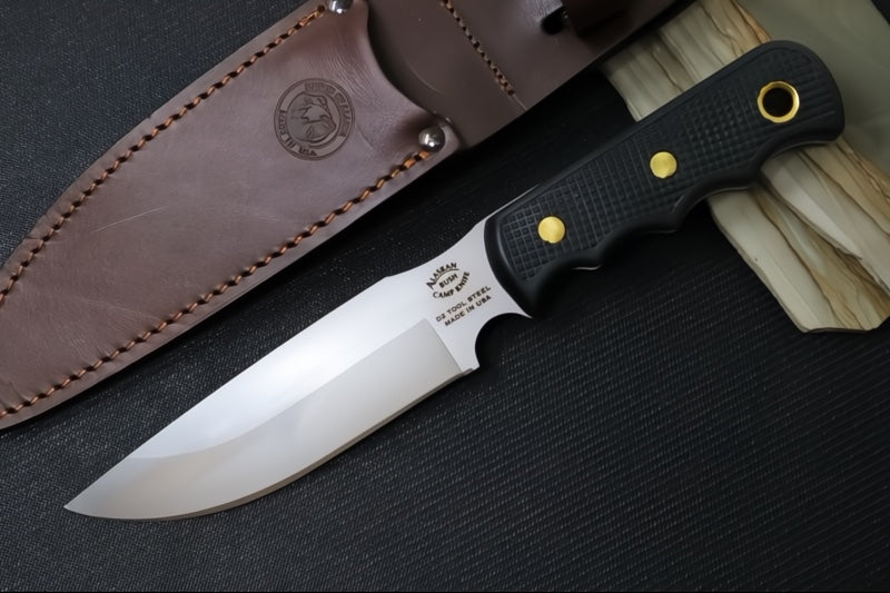 Knives of Alaska Bush Camp Fixed Blade - Black Surgrip Handle / D2 Tool Steel / Drop Point Blade / Brown Leather Sheath 00014FG