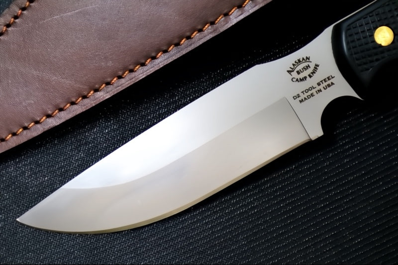 Knives of Alaska Bush Camp Fixed Blade - Black Surgrip Handle / D2 Tool Steel / Drop Point Blade / Brown Leather Sheath 00014FG