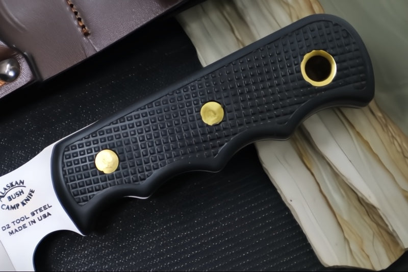 Knives of Alaska Bush Camp Fixed Blade - Black Surgrip Handle / D2 Tool Steel / Drop Point Blade / Brown Leather Sheath 00014FG