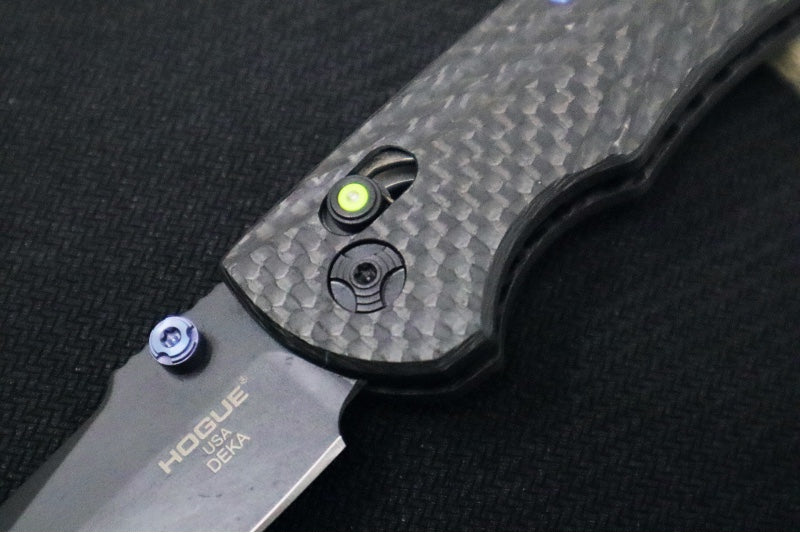 Hogue Knives Deka Collector Series - Black Cerakote Finish / Clip Point Blade / Carbon Fiber Handle / Green Tritium Axis Lock 24299-LIM