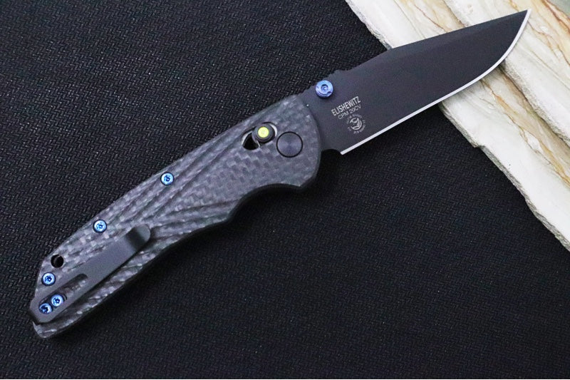 Hogue Knives Deka Collector Series - Black Cerakote Finish / Clip Point Blade / Carbon Fiber Handle / Green Tritium Axis Lock 24299-LIM