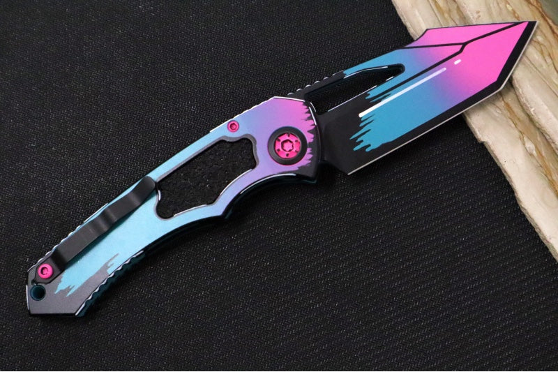 Heretic Knives Pariah Manual - Miami Vice Cel Shading Finished Blade / CPM-Magancut Steel / Miami Vice Cel Shading Aluminum Handle & Black Grip Tape Inlays H047-CS-MV