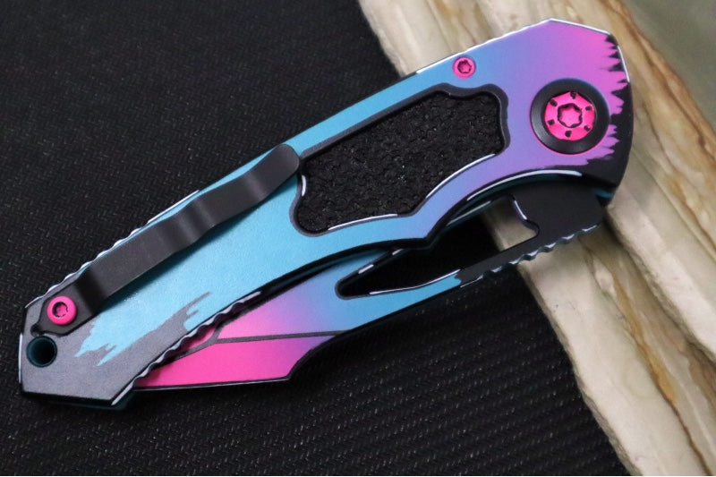 Heretic Knives Pariah Manual - Miami Vice Cel Shading Finished Blade / CPM-Magancut Steel / Miami Vice Cel Shading Aluminum Handle & Black Grip Tape Inlays H047-CS-MV
