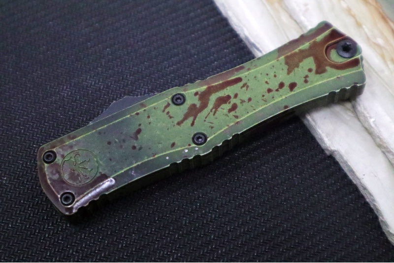 Microtech Mini Hera II Outbreak OTF - Dagger Blade / Dark Apolcoplyptic Finish / Outbreak Green Anodized Aluminum Handle with Blood Splatter / Deep Engraved Biohazard Symbol 1702M-1OBDS - Northwest Knives