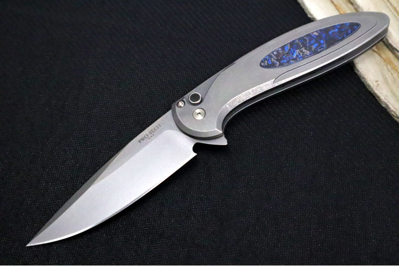 Pro Tech Cambria Flipper 2025 Custom 013 - Blasted & Tumbled Two Toned 17-4 Steel Handle with Blue TechnoCarbo Inlay / CPM-Magnacut Steel / Stonewashed Finish / Black Lip Pearl Button / Blue Anodized Titanium Clip #31of60