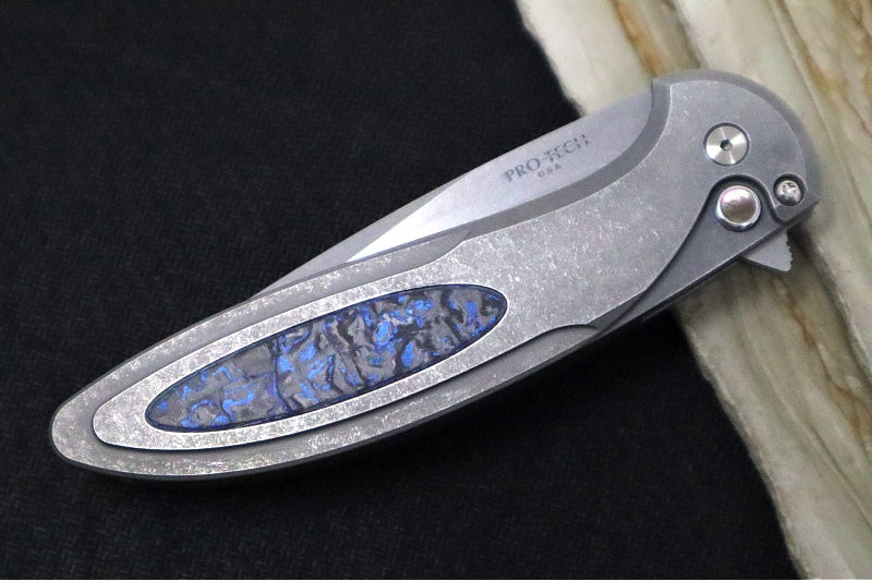 Pro Tech Cambria Flipper 2025 Custom 013 - Blasted & Tumbled Two Toned 17-4 Steel Handle with Blue TechnoCarbo Inlay / CPM-Magnacut Steel / Stonewashed Finish / Black Lip Pearl Button / Blue Anodized Titanium Clip #31of60
