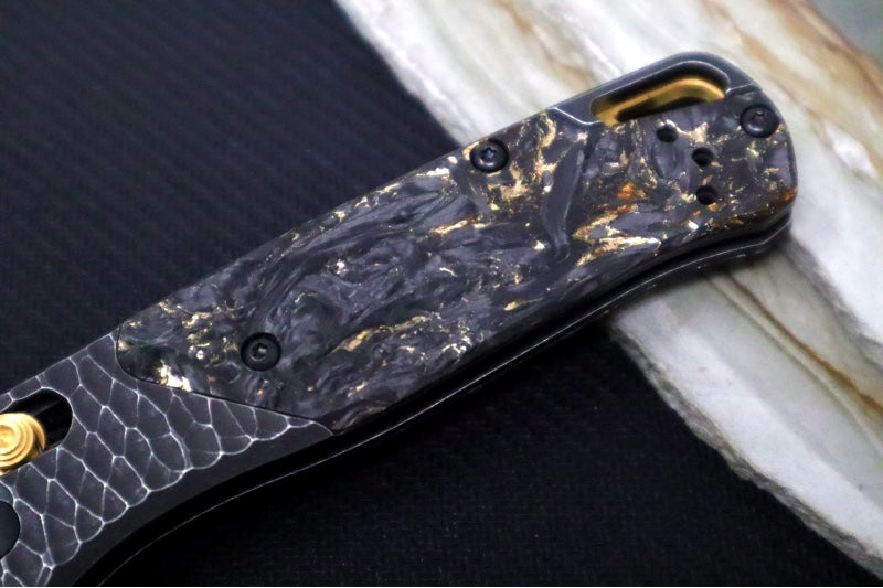 Benchmade 535 Bugout Gold Class - Titanium Hammered Bolster & Fatcarbon Steller Handle Onlay / M390 Steel / Drop Point Blade with Black Cerakote / Last Chance Gulch MT Blade Engraving / Gold Plated Backspacer & Thumb Stud