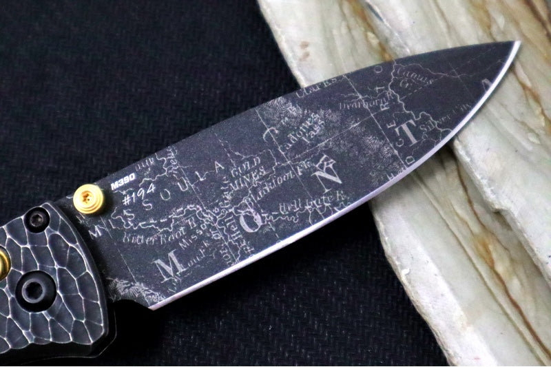 Benchmade 535 Bugout Gold Class - Titanium Hammered Bolster & Fatcarbon Steller Handle Onlay / M390 Steel / Drop Point Blade with Black Cerakote / Last Chance Gulch MT Blade Engraving / Gold Plated Backspacer & Thumb Stud