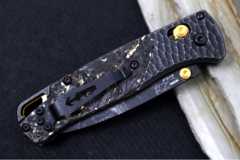 Benchmade 535 Bugout Gold Class - Titanium Hammered Bolster & Fatcarbon Steller Handle Onlay / M390 Steel / Drop Point Blade with Black Cerakote / Last Chance Gulch MT Blade Engraving / Gold Plated Backspacer & Thumb Stud