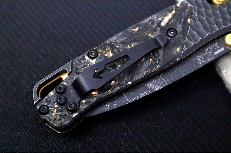 Benchmade 535 Bugout Gold Class - Titanium Hammered Bolster & Fatcarbon Steller Handle Onlay / M390 Steel / Drop Point Blade with Black Cerakote / Last Chance Gulch MT Blade Engraving / Gold Plated Backspacer & Thumb Stud