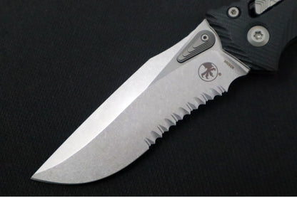 Microtech Amphibian Folder RAM-Lok - Drop Point with Partial Serrate / Fluted Black G-10 Handle 137RL-11FLGTBK