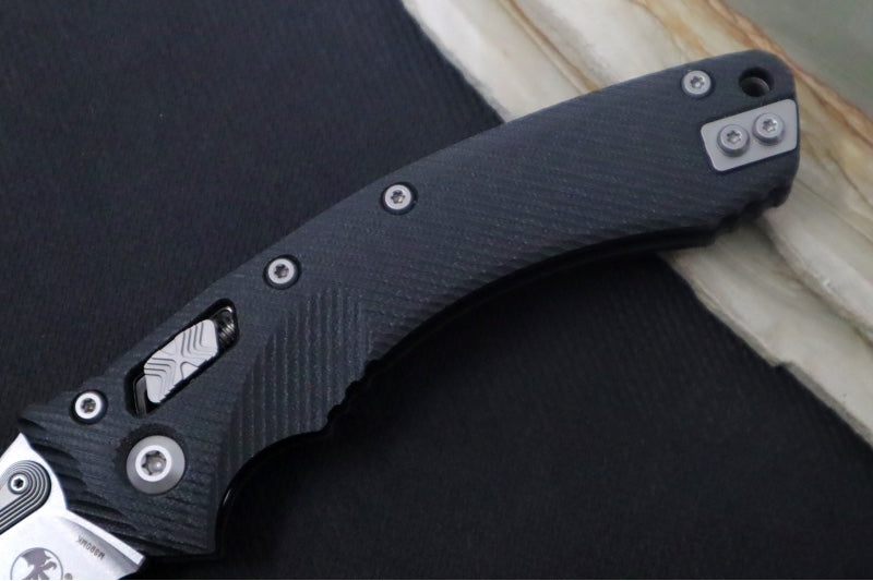 Microtech Amphibian Folder RAM-Lok - Drop Point with Partial Serrate / Fluted Black G-10 Handle 137RL-11FLGTBK - Northwest Knives