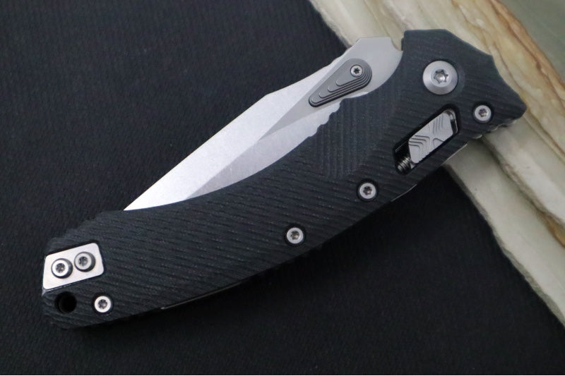 Microtech Amphibian Folder RAM-Lok - Drop Point with Partial Serrate / Fluted Black G-10 Handle 137RL-11FLGTBK