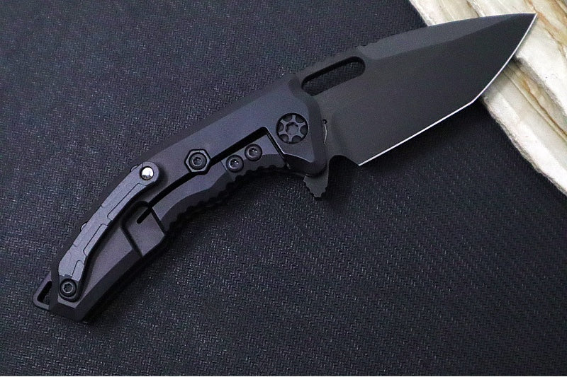Heretic Knives Medusa Manual Flipper - Tanto Blade / CPM-Magnacut Steel / Black Anodized Aluminum Handle with Black Grip-Tape Inlays / Black Tactical DLC Finished Blade and Hardware H009-6A-T