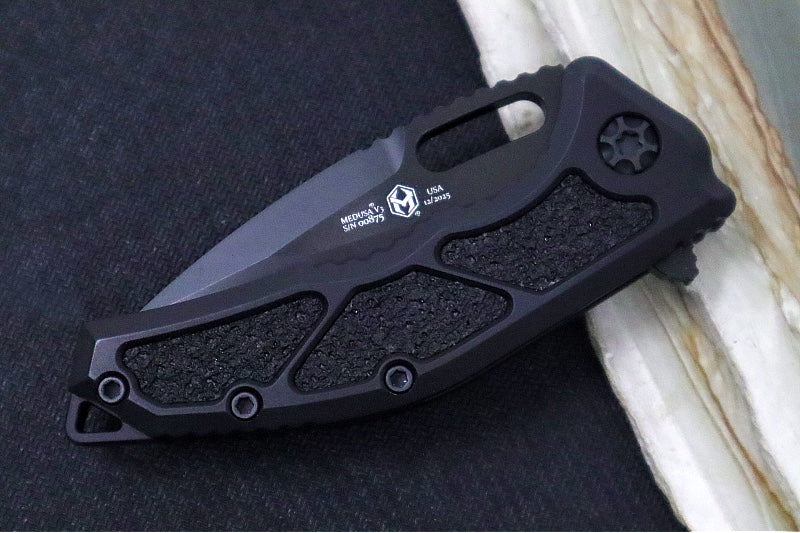 Heretic Knives Medusa Manual Flipper - Tanto Blade / CPM-Magnacut Steel / Black Anodized Aluminum Handle with Black Grip-Tape Inlays / Black Tactical DLC Finished Blade and Hardware H009-6A-T