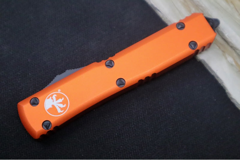 Microtech Ultratech OTF - Single Edge with Partial Serrates / Black Blade / Orange Body 121-2OR