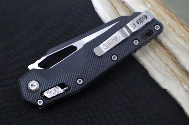 Microtech MSI Manual Folder - Black Two-Toned Finished Blade with Partial Serrate / Fluted Black G-10 Handle 210-2FLGTBK - Northwest Knives