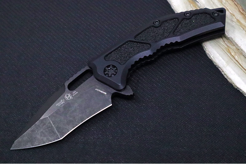 Heretic Knives Medusa Manual Flipper - Recurve Blade / CPM-Magnacut Steel / Black Anodized Aluminum Handle with Black Grip-Tape Inlays / Black Tactical DLC Finished Blade and Hardware H010-6A-T