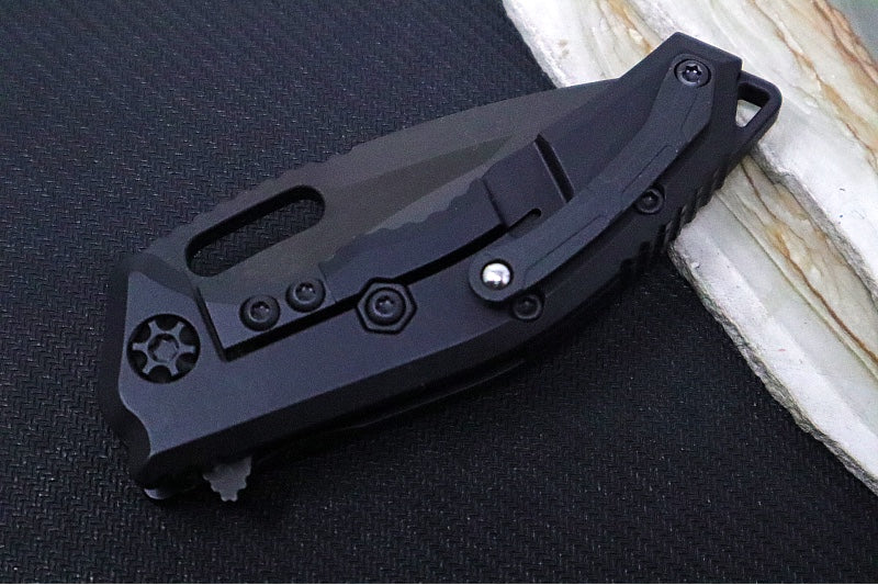 Heretic Knives Medusa Manual Flipper - Recurve Blade / CPM-Magnacut Steel / Black Anodized Aluminum Handle with Black Grip-Tape Inlays / Black Tactical DLC Finished Blade and Hardware H010-6A-T - Northwest Knives