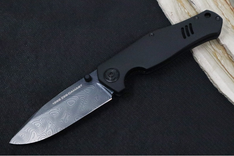 Boker 1969 Z28 Damascus Shadow - Black Anodized Handle Scales / Drop Point Blade / PVD Finished Chad Nichols Tread Pattern Damascus 111110DAM - Northwest Knives