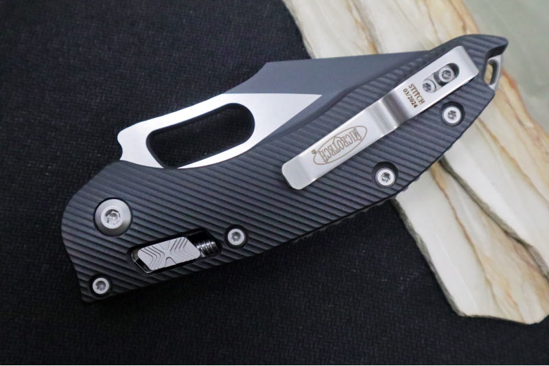 Microtech Stitch RAM-Lock Manual - Spear Point Blade with Partial Serrates / Black Two-Toned Finish / Black Fluted Anodized Aluminum Handle 169RL-2FL