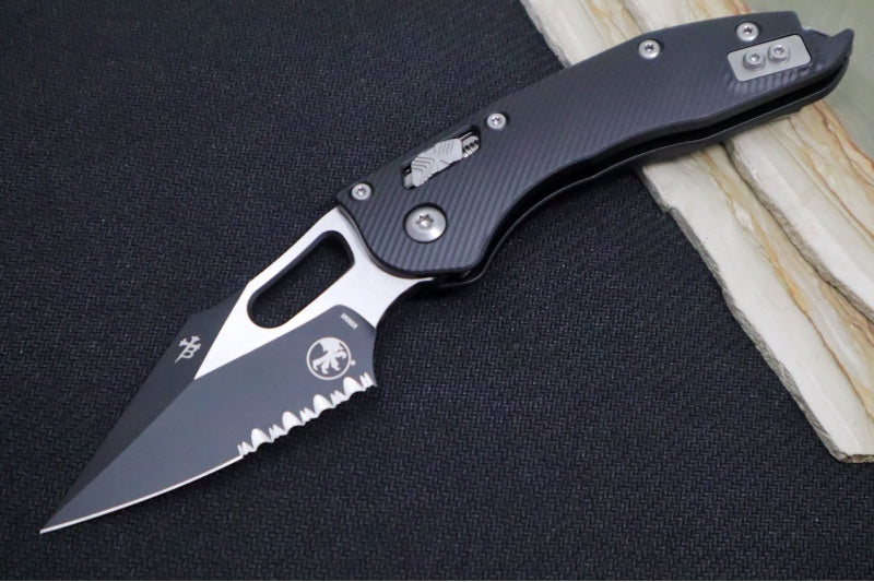 Microtech Stitch RAM-Lock Manual - Spear Point Blade with Partial Serrates / Black Two-Toned Finish / Black Fluted Anodized Aluminum Handle 169RL-2FL