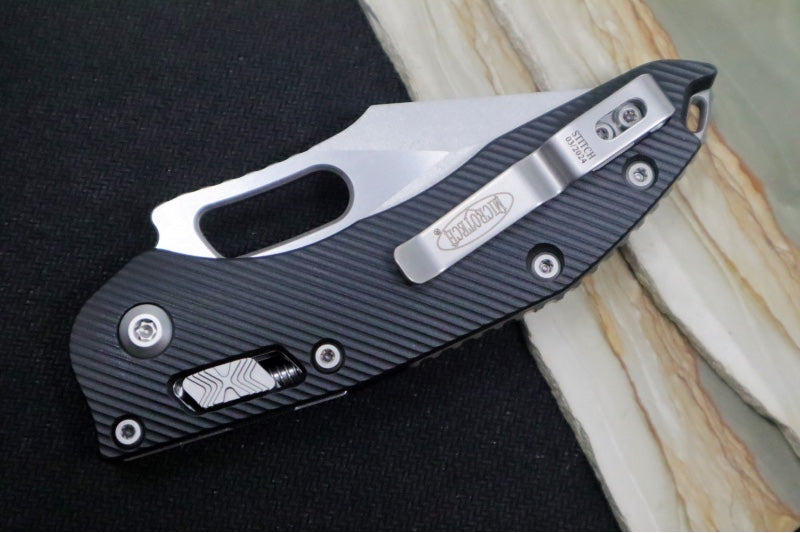 Microtech Stitch RAM-Lock Manual - Spear Point Blade with Partial Serrate / Stonewashed Finish / Black Fluted Anodized Aluminum Handle 169RL-11FL