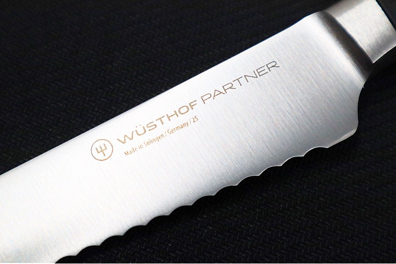 Wusthof Partner - 5" Serrated Utility Knife - Fully forged German stainless steel (X5.0 CrMoV 15) - Made in Solingen, Germany - Northwest Knives