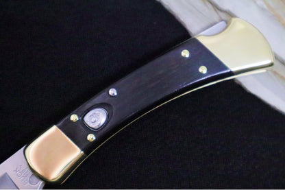 Buck 110 Hunter Auto - Plain Blade / Ebony Wood Handle