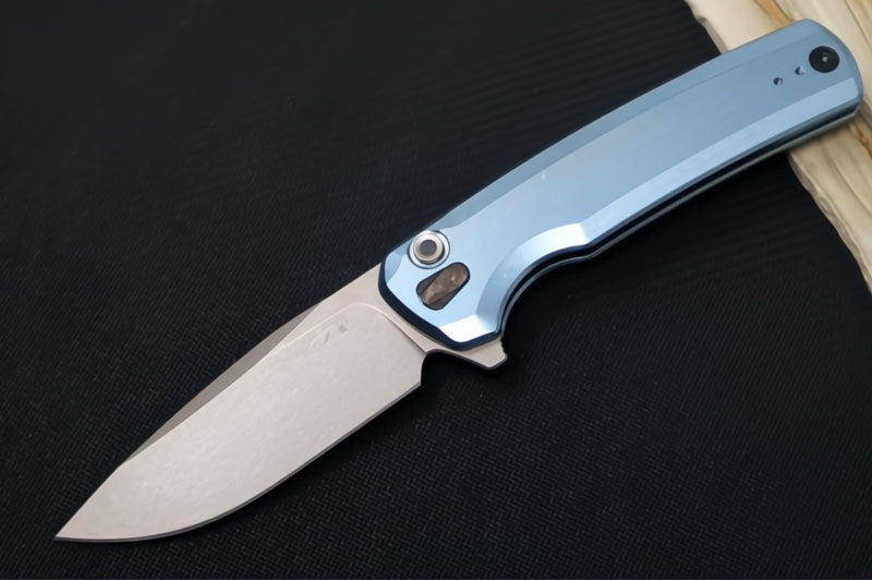 Zero Tolerance 0044BLU Button Lock Flipper Limited Edition - CPM-S90V Steel / Stonewashed Finish / Blue Anodized Full Titanium Handle