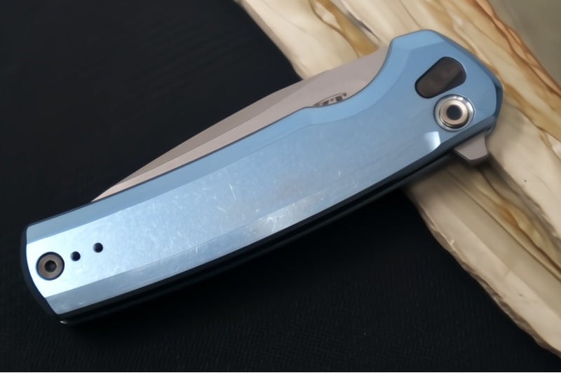 Zero Tolerance 0044BLU Button Lock Flipper Limited Edition - CPM-S90V Steel / Stonewashed Finish / Blue Anodized Full Titanium Handle