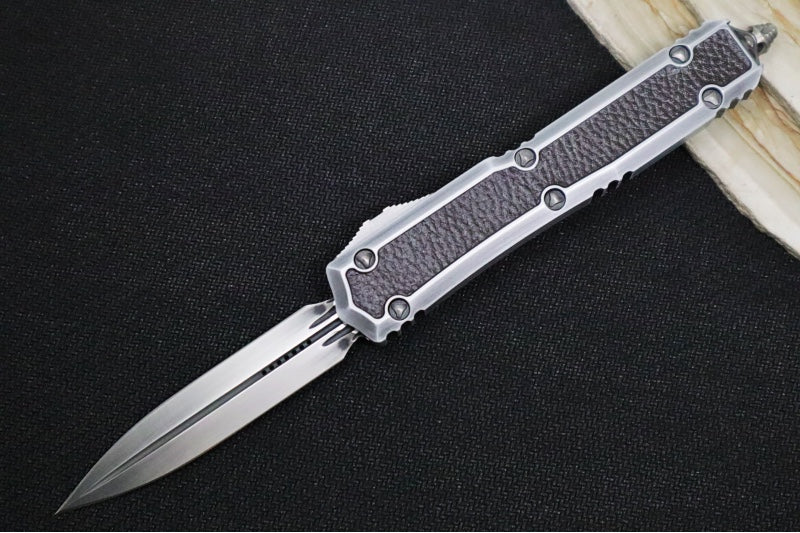 Microtech Signature Series Makora OTF - Black Distressed Blade / Dagger Style / Silver Anodized Aluminum Handle with Black Leather Inlays / Nickel Boron Internals - 206-1MD