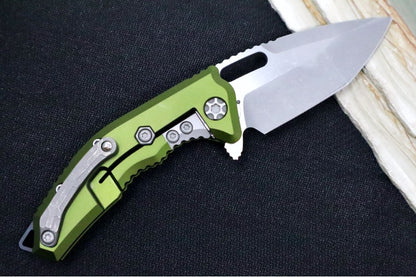 Heretic Knives Medusa Manual Flipper - Tanto Blade / CPM-Magnacut Steel / OD Green Anodized Aluminum Handle with Black Grip-Tape Inlays / Battleworn Finished Blade and Hardware H009-5A-GRN